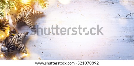 Christmas composition; Christmas decoration and fir tree branches, holidays light on white wooden background;  Flat lay, top view