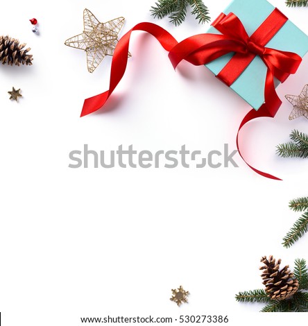 Christmas holiday composition; Christmas gift, fir tree branches and Christmas ornament on white background. Flat lay; top view.
