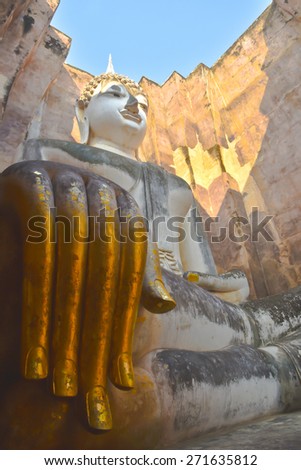 Public place history park , Thailand , Side view of Buddha statue surrounding with walls
