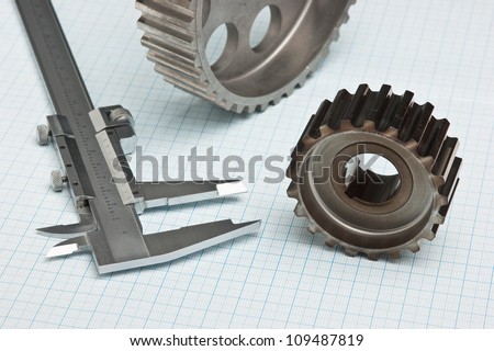 gears and caliper on graph paper
