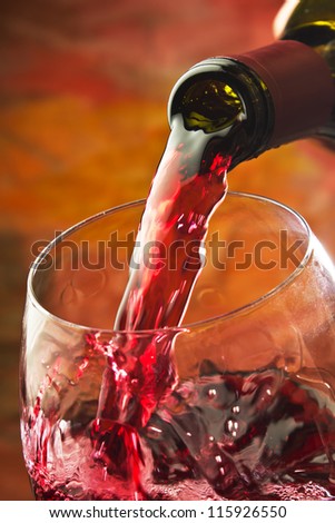 Red Wine Being Poured Into Wine Glass