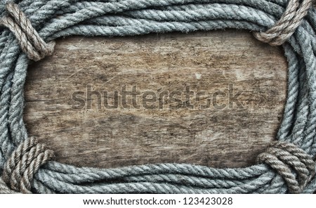 picture frame of rope on a old wooden background