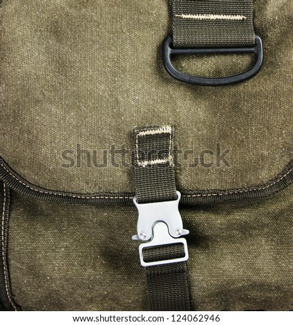 buckle on the old green backpack