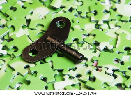 key on pile of green puzzle