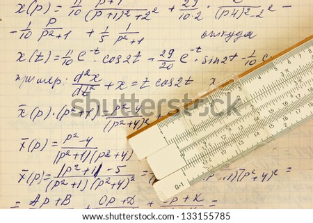 Page of old vintage paper with the calculation of the mathematics and slide rule
