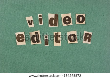 word video editor cut from newspaper on green background