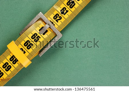 meter belt slimming on the green background