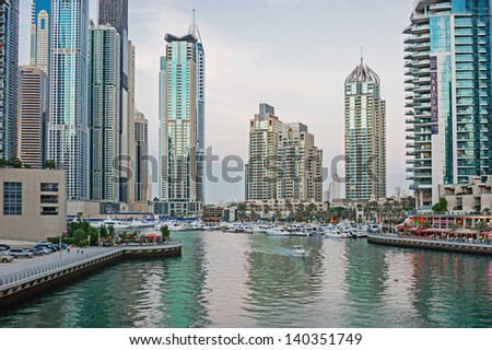 DUBAI, UAE - NOVEMBER 14: Modern buildings in Dubai Marina at sunset, on November 14, 2012, Dubai, UAE. In the city of artificial channel length of 3 kilometers along the Persian Gulf.