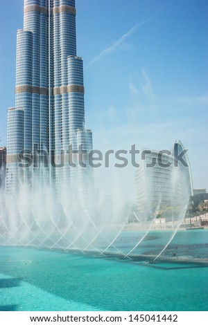 DUBAI, UAE - NOVEMBER 14: The Dancing fountains downtown and in a man-made lake in Dubai, UAE on November 14, 2012. The Dubai Dancing fountains are world\'s largest fountains with height 150 m.
