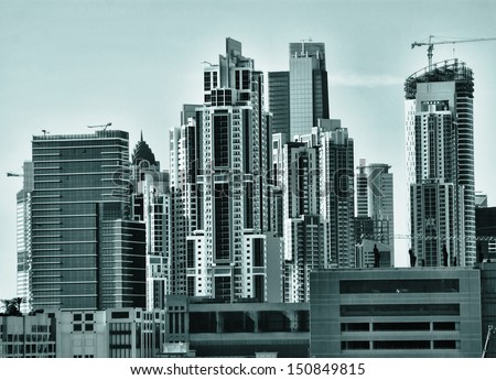 DUBAI, UAE - NOVEMBER 18: Modern buildings in Dubai Marina, on November 18, 2012, Dubai, UAE. Dubai was the fastest developing city in the world between 2002 and 2008.