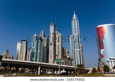 DUBAI, UAE - NOVEMBER 5: Modern buildings in Dubai, on November 5, 2013, Dubai, UAE. Dubai was the fastest developing city in the world between 2002 and 2008.