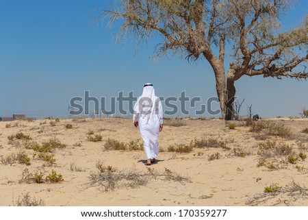Arab man in national dress in desert
