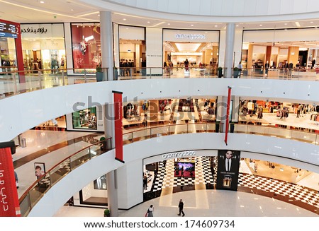 DUBAI, UAE - OCTOBER 31, 2013: Inside modern luxuty mall in Dubai. At over 12 million sq ft, it is the world\'s largest shopping mall based on total area.