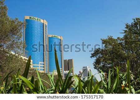 DUBAI, UAE -  OCTOBER 30: Deira Twin Towers in Dubai Creek October 30, 2013 in Dubai, UAE. The towers were constructed in 1998 and height of each building is 102m.