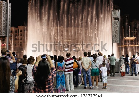 DUBAI, UAE - OCTOBER 31, 2013: Fountain in the lake near Dubai Mall. Lake - 6600 lights and 25 projectors, it shoots water 150 m into the air. United Arab Emirate
