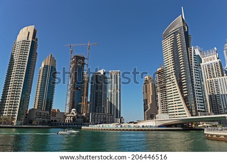 DUBAI, UAE - NOVEMBER 11: Modern buildings in Dubai Marina, on November 11, 2013, Dubai, UAE. In the city of artificial channel length of 3 kilometers along the Persian Gulf.