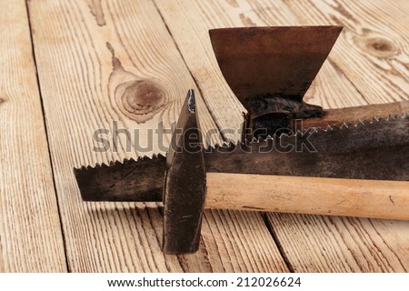 Old carpentry tools on a wooden background