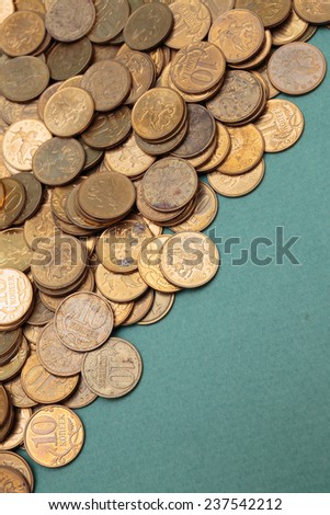 heap of coins on a green background