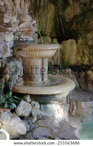 small fountain in a stone niche