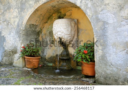 small fountain in a stone niche