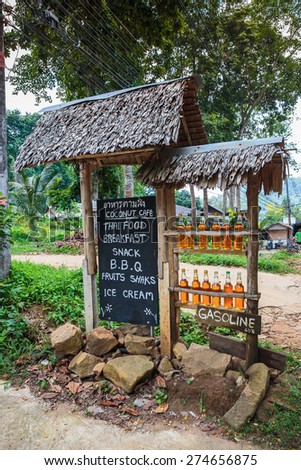 Bottles with gasoline on a rural roadside gas station in Thailand