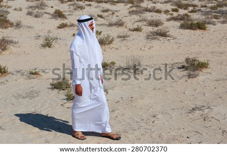DUBAI, UAE-NOVEMER 7, 2013: Arab man in desert
