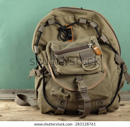Old travel backpack on the floor