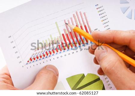 pencil in hand and working paper chart