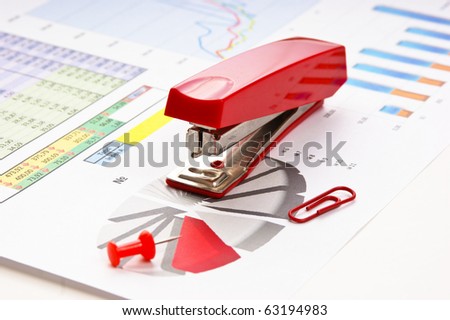 Stapler and working paper with a diagram
