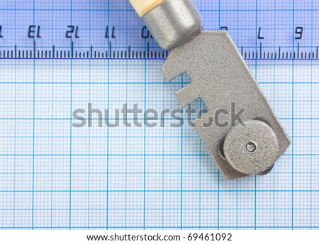 glass cutter and  ruler on the glass