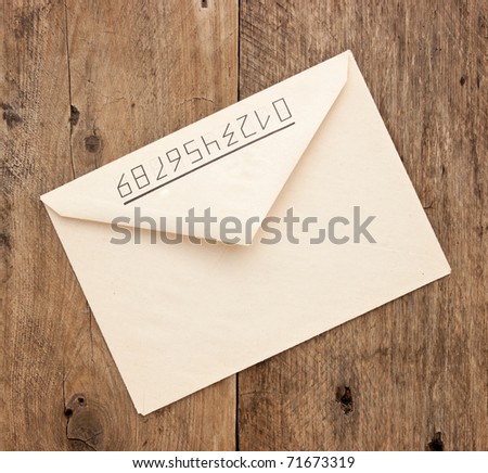 old postal envelope on wooden background