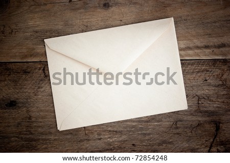 old postal envelope on wooden background