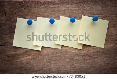 reminder notes on a background of the old wooden logs