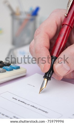 businessman signs a working paper