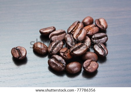 pile of coffee beans on a gray table
