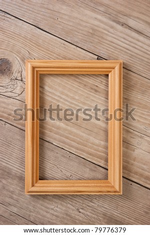 old picture frame on a wooden background