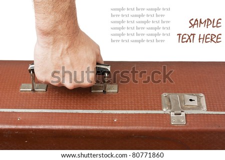 old suitcase in hand isolated on white background