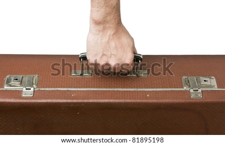 old suitcase in hand isolated on white background