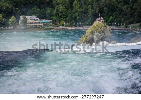Rheinfall - biggest waterfall in Europe, located in Schaffhausen, Switzerland. A massive rock in the middle of the river offering spectacular view to the tourists on top of them.