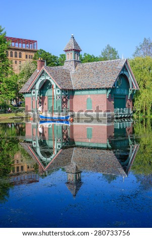 Charles A. Dana Discovery Center with S.S. Hangover docked in front of it - May 19, 2015, Harlem Meer, Central park, New York city, NY, USA