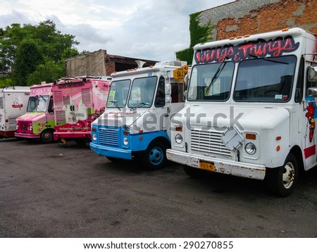 A row of food and ice cream trucks on a parking lot - June 23, 2015, Brooklyn, New York City, NY, USA