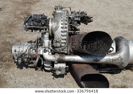 The helicopter engine which is pulled out outside. Spare parts and details of a design of helicopters.