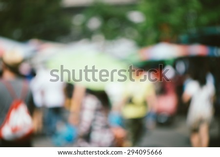 Blurred background : people shopping at market fair in sunny day, blur background with bokeh - vintage effect style pictures.