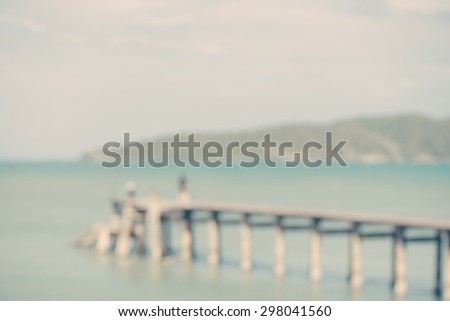 island and sea beach over the bridge in blurred background.Picture in retro vintage style.