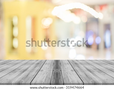 Wooden board empty table in front of blurred background. Perspective grey wood over blur in coffee shop - can be used for display or montage your products.Mock up for display product.Vintage filter.
