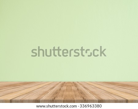 Empty tropical wood table top with green stone wall,Mock up background for display of product