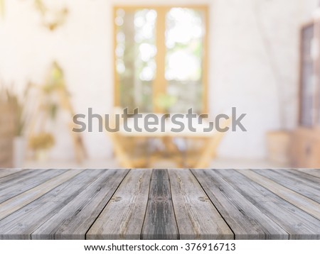 Wooden board empty table in front of blurred background. Perspective gray wood over blur in coffee shop - can be used for display or montage your products.Mock up for display of product.