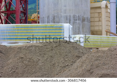 the sand and facing panels on the background structures construction company