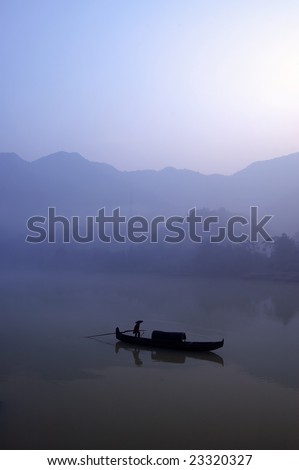 Early morning, a fisher at work