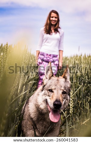Young lady on a walk with a dog